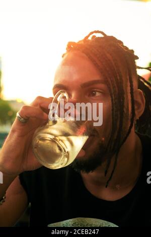 Young man sitting in bar Stock Photo