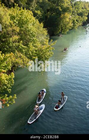 Young people eager to get outdoors during the coronavirus pandemic find a quiet spot to float in the cool waters of Barton Creek south of downtown Austin on a hot summer Sunday. ©Bob Daemmrich Stock Photo