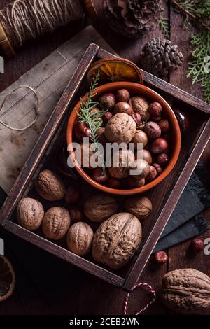 From above whole uncrackable nuts assortment in the wooden box. Stock Photo
