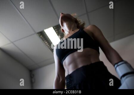 Strong Woman in boxing gloves staying on ring Stock Photo