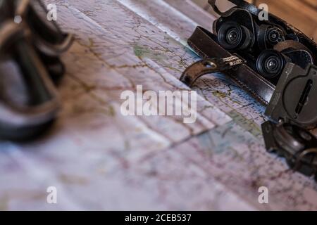 planning a trip on a map with vintage motorcycle glasses and old prismatic Stock Photo