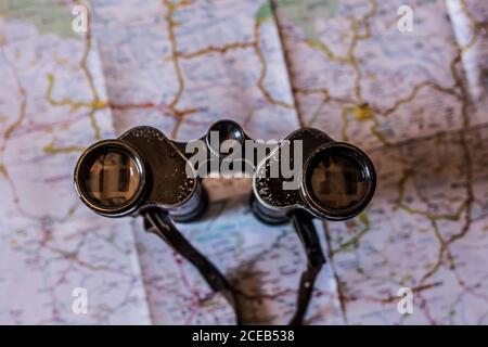 planning a trip on a map with old prismatic Stock Photo