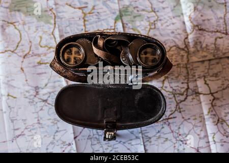 planning a trip on a map with old prismatic Stock Photo