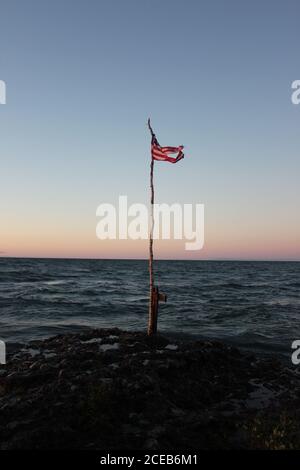Sunset with Flag in Michigan UP Stock Photo