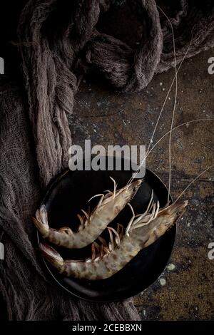 Raw prawns on the plate Stock Photo