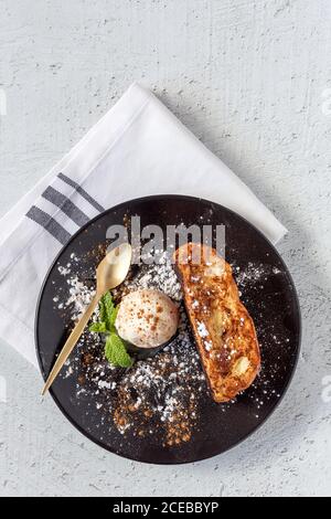 French toast with vanilla ice cream, cinnamon and mint. Flat lay. Top view Stock Photo