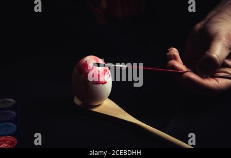 Crop hand painting Easter egg Stock Photo