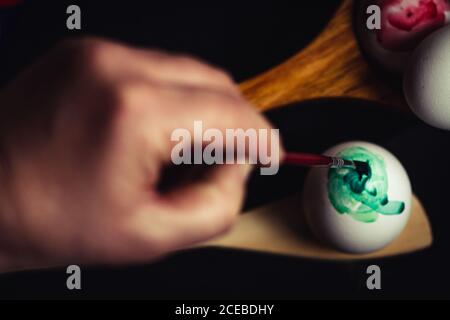 Crop hand painting Easter egg Stock Photo