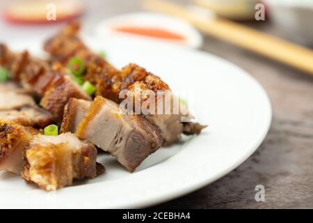 Roasted pork belly served in white plate Stock Photo