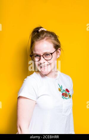Blonde Woman posing in wall Stock Photo