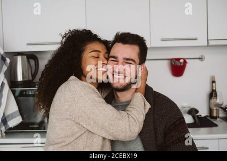 Multiethnic couple in modern kitchen Stock Photo