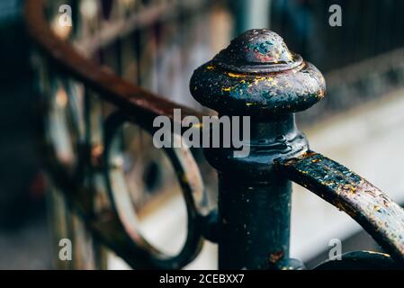 Close-up dark metal fence and handrail on street in the city. Stock Photo