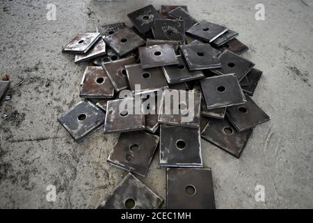 metallic pieces in the fabrication workshop. Stock Photo