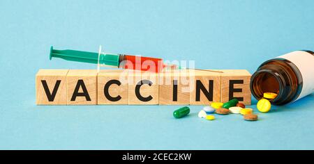 VACCINE word written on wood blocks. Medical concept Stock Photo