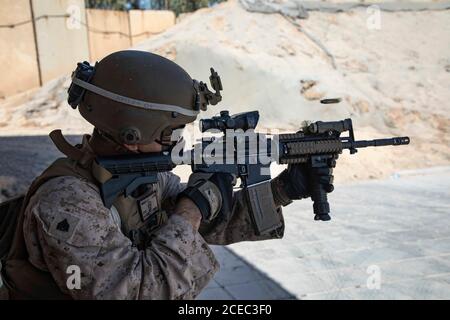 A U.S. Marine with 2nd Battalion, 5th Marine Regiment, assigned to Special Purpose Marine Air-Ground Task Force – Crisis Response - Central Command 20.2, fires his M4 Carbine during a combat marksmanship range at the Baghdad Embassy Compound in Iraq, Aug. 15, 2020. The SPMAGTF-CR-CC is a crisis response force, prepared to deploy a variety of capabilities across the region. (U.S. Marine Corps photo by Cpl. Thomas Spencer)