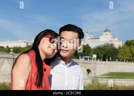 Asian couple standing in park Stock Photo
