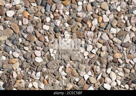 natural texture background concrete with stones sunny weather outdoor Stock Photo