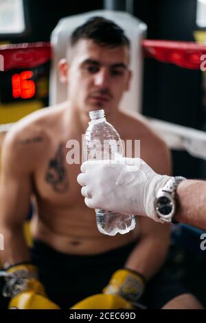 Male trainer giving boxing training to female athletic Stock Photo - Alamy