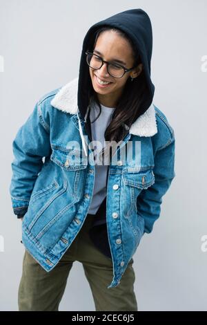 Young Woman posing near wall Stock Photo