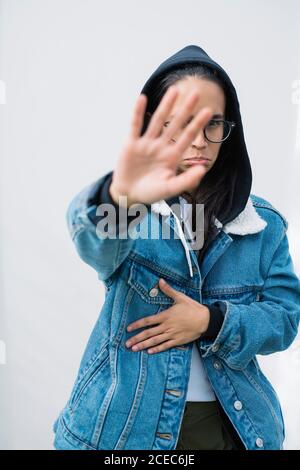 Young Woman posing near wall Stock Photo