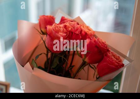 bouquet of roses in a delicate paper bouquet Stock Photo
