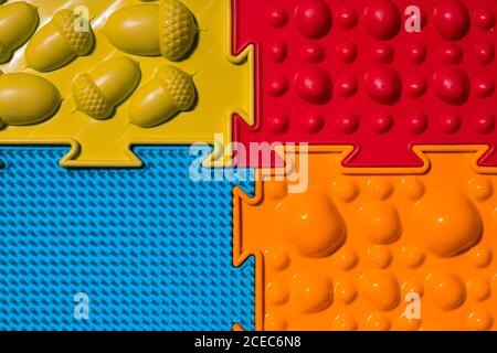 Orthopedic mats view from above. Bright colorful multicolored mats to prevent flat feet and foot massage. Stock Photo