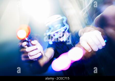 man playing video game in dark Stock Photo