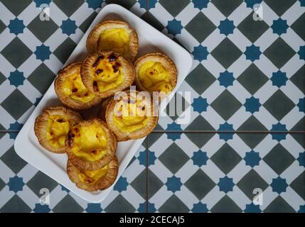 Fresh egg baked tarts on tray Stock Photo