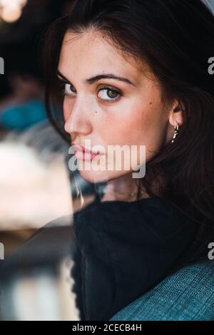 Young Woman sitting on chair Stock Photo
