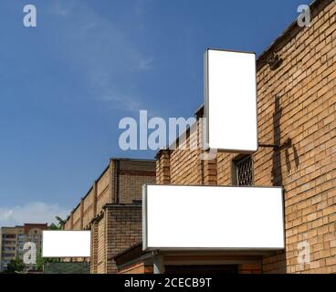 Billboards with white isolated space for advertising and posters on city streets. Stock Photo