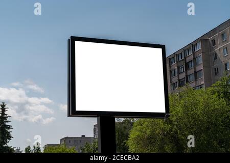 Billboard with white isolated space for advertising and posters on city streets. Stock Photo
