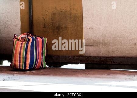 Multi color on Plastic sack placed on the concrete floor in the market Stock Photo