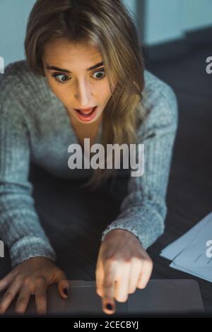 Shocked scared Woman at laptop Stock Photo