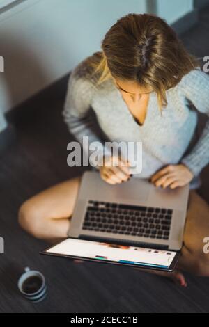 Top view of Woman typing at laptop Stock Photo