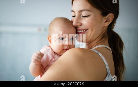 Portrait of a mother with her newborn baby