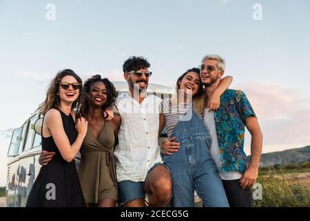 friends hugging in nature Stock Photo