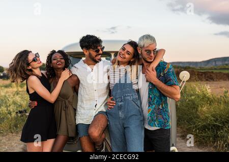 friends hugging in nature Stock Photo