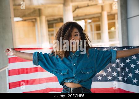 Young Woman holding flag of America Stock Photo