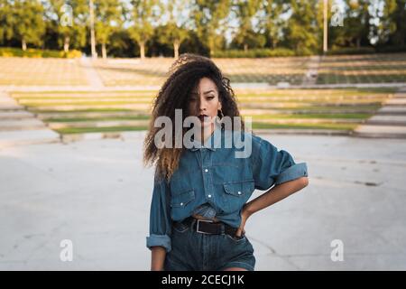 African-American Woman standing near park Stock Photo