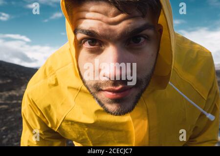 man looking at camera in mountains Stock Photo