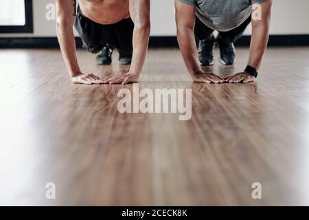 Men doing push-ups Stock Photo
