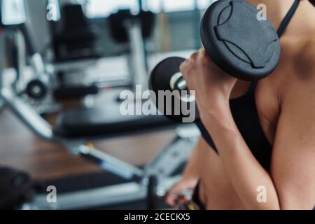 Woman working out with dumbbells Stock Photo