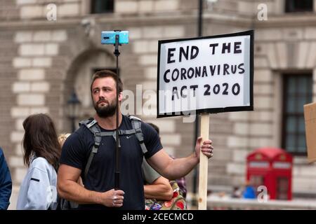 Protester holding sign at Anti-Lockdown demonstration, Whitehall, London, 29 August 2020 Stock Photo