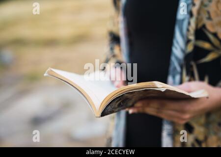 Crop Woman holding notepad Stock Photo