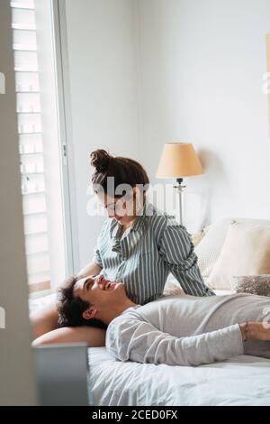 Happy couple on bed Stock Photo