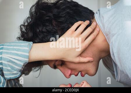 Tender couple lying on bed Stock Photo