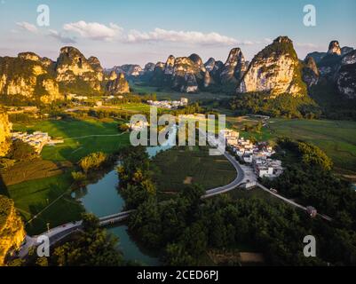 Guangxi fields and town surrounded by mountains Stock Photo