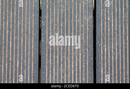 Texture patio slats with a crack and sand on the slats. Stock Photo