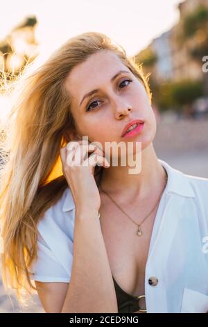Gorgeous female standing on beach Stock Photo
