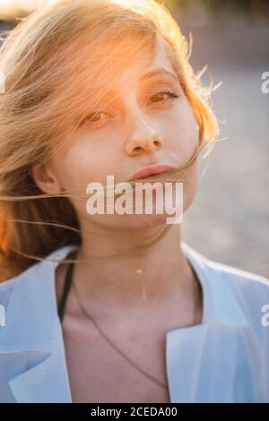 Gorgeous female standing on beach Stock Photo